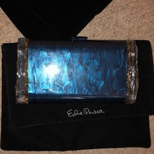 Barely worn gold and navy acrylic glitter clutch